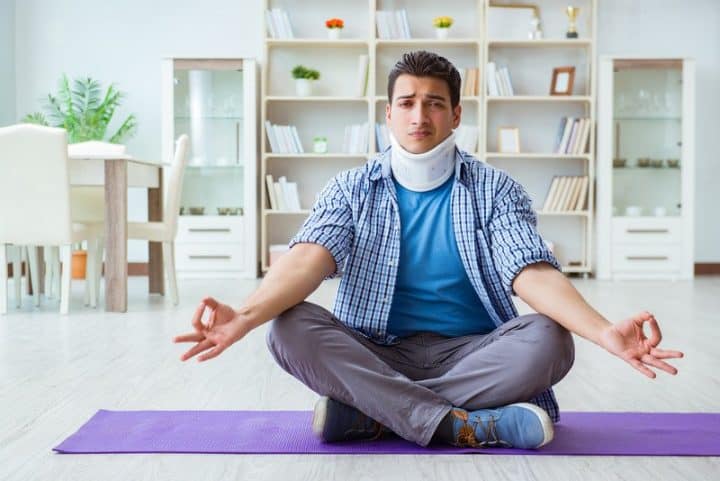 Man with neck injury doing yoga